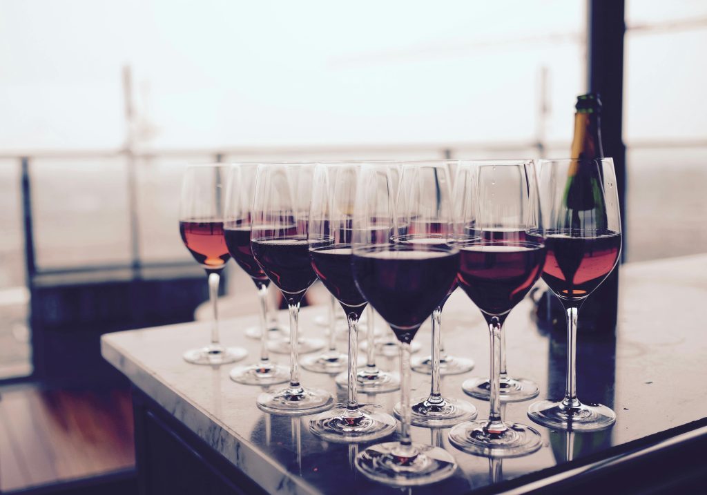 Glasses of wine sitting on table
