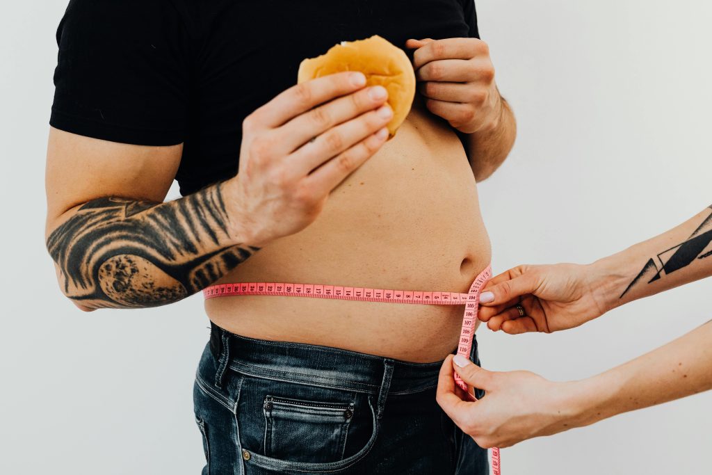 Man getting his waist measured