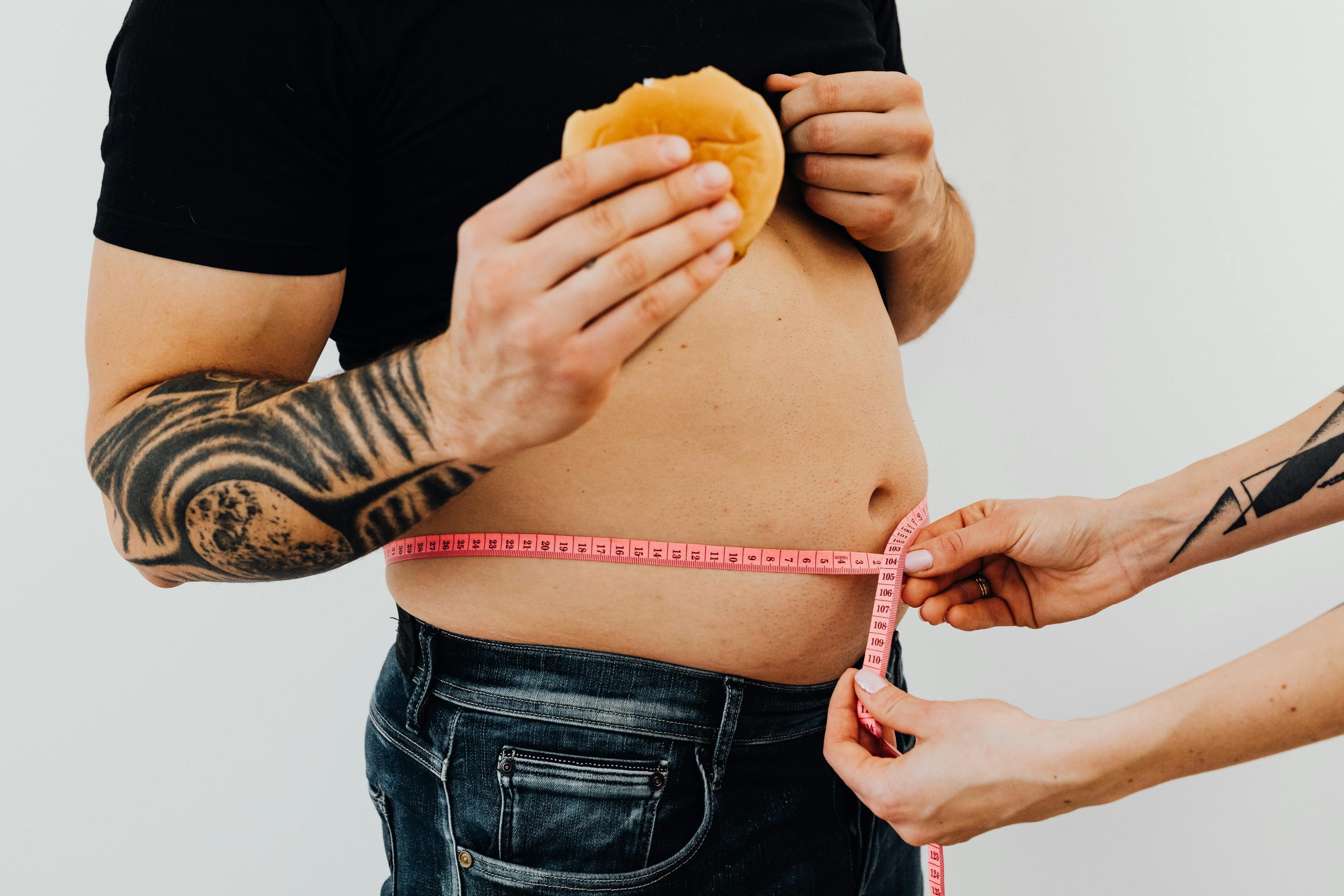 Man getting his waist measured