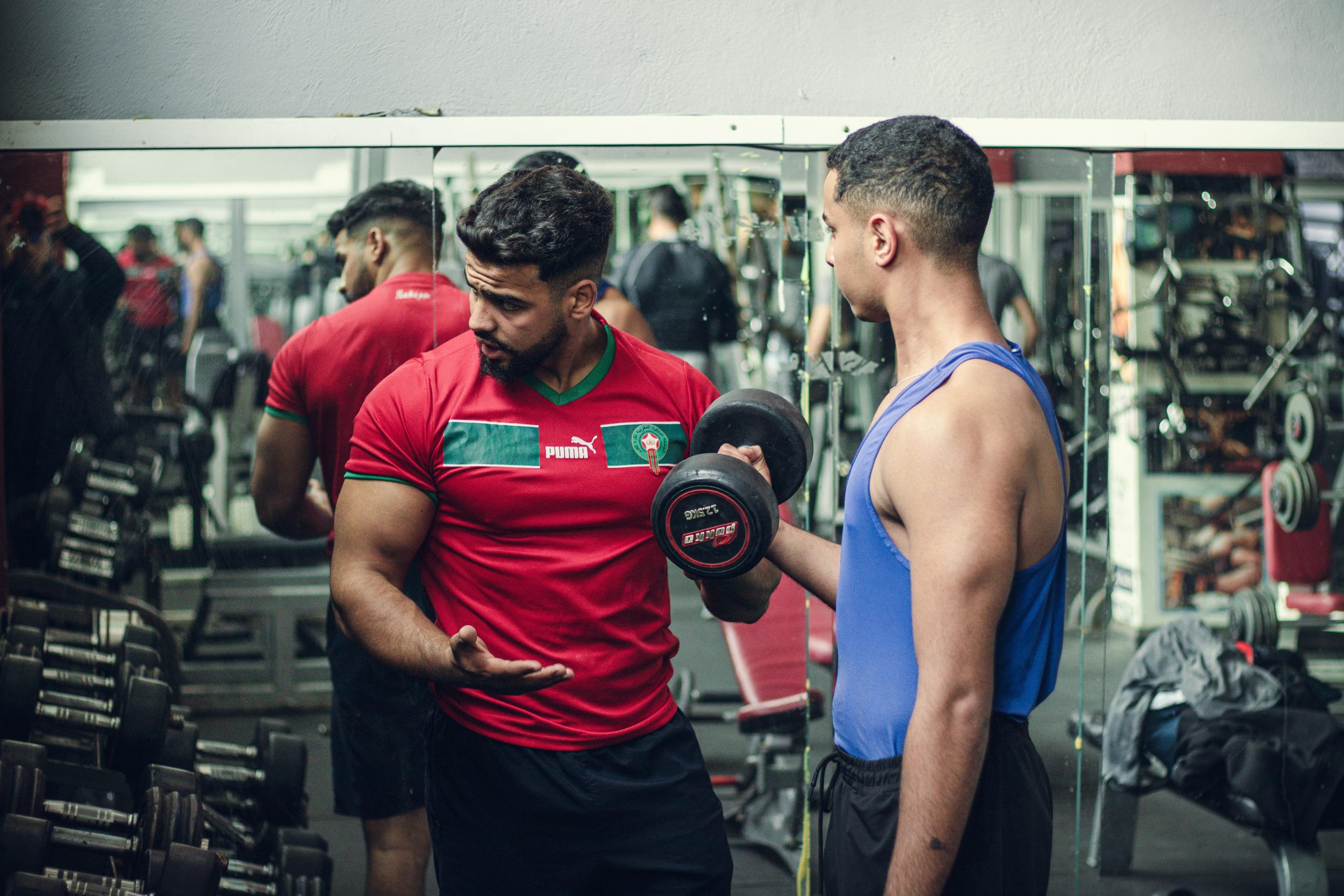 Two men working out in a gym