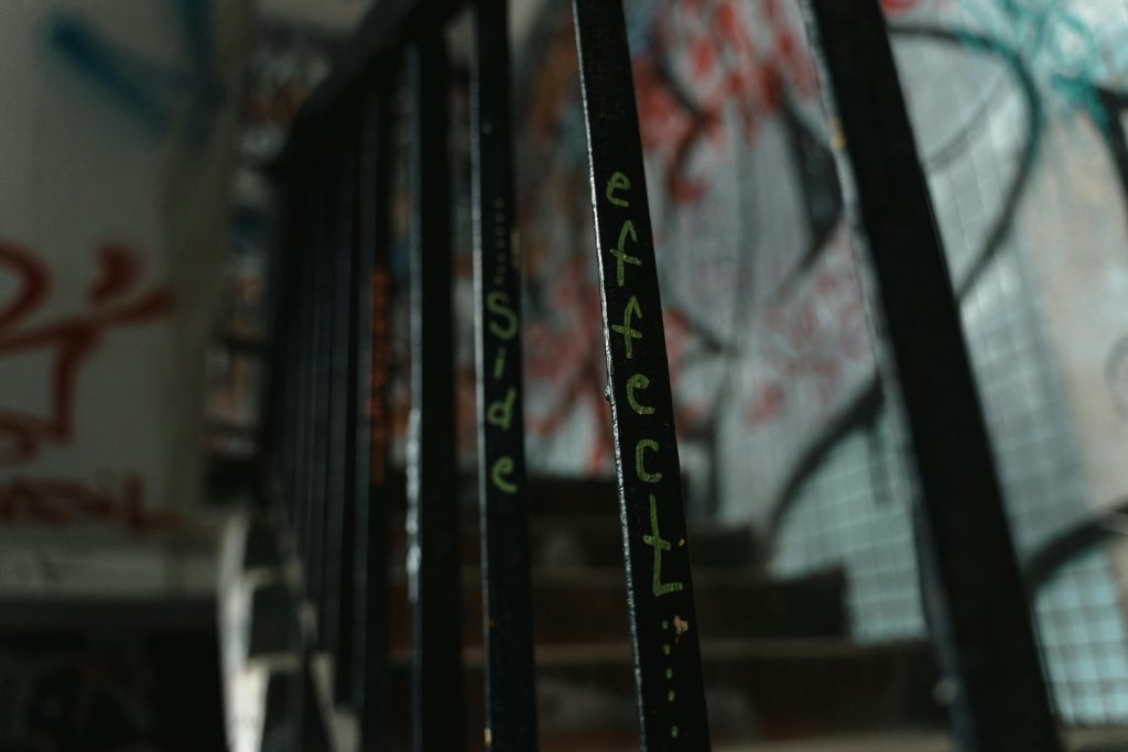 "Side effects" written on a stair railing